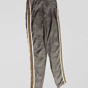 Women’s gray and white houndstooth sweatpants with yellow vertical stripe